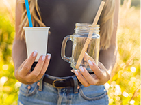 Girl holding two cups