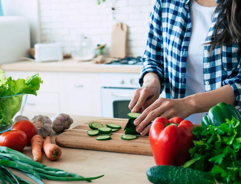 cutting vegetables in kitchen