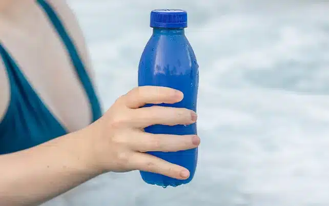 hand holding natural blue beverage